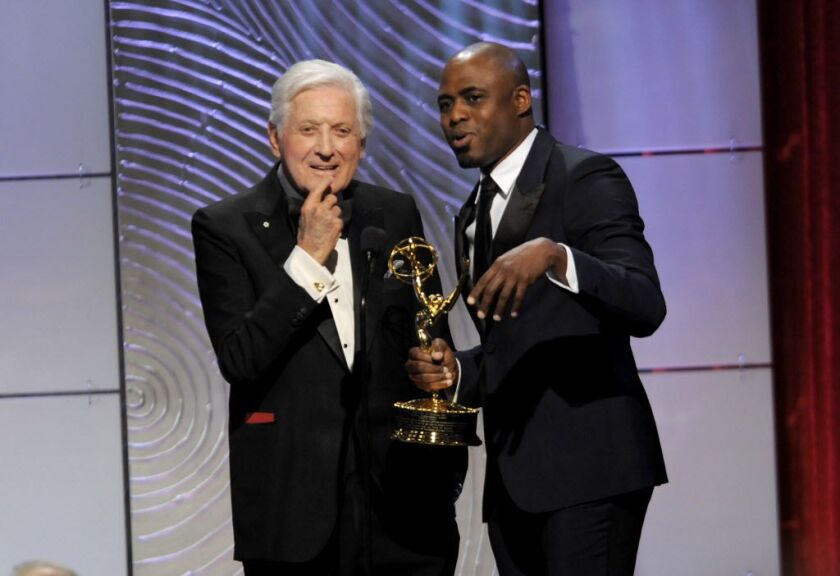 In this June 16, 2013 file photo, Wayne Brady preesents the Lifetime Achievement Aaward to Monty Hall at the 40th Annual Daytime Emmy Awards in Beverly Hills, Calif. | Chris Pizzello/Invision/AP, File\