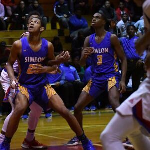 Simeon’s Andre Casey Jr. (23) and Simeon’s Antonio Reeves (3) wait for a rebound. Worsom Robinson/For the Sun-Times.