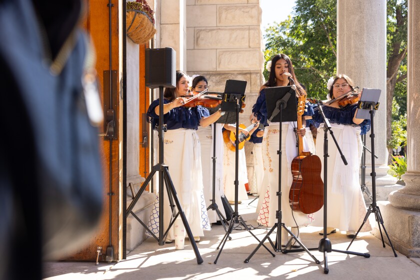 The all-woman mariachi group, Mariachi Sirenas, plays on the steps of St. Hedwig Church in Bucktown, Sunday Sept. 7, 2025.