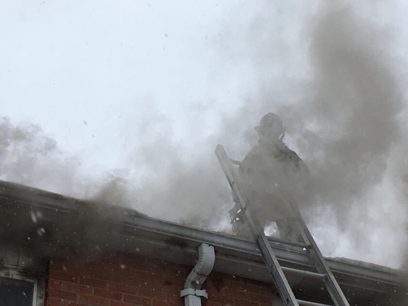 Firefighters battle an apartment fire that left a man displaced Dec. 29 in Aurora. | Aurora Fire Department