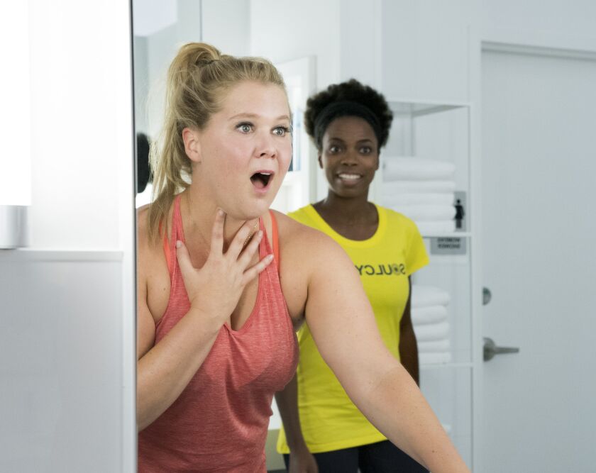 Renee (Amy Schumer) can’t believe what she sees in the mirror in “I Feel Pretty.” | STXfilms