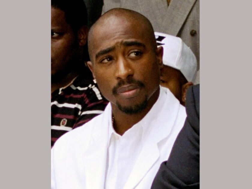 In this Aug. 15, 1996, file photo, rapper Tupac Shakur attends a voter registration event in South Central Los Angeles. Shakur and Seattle-based rockers Pearl Jam are among the first-time nominees on the ballot for induction next year into the Rock and Ro