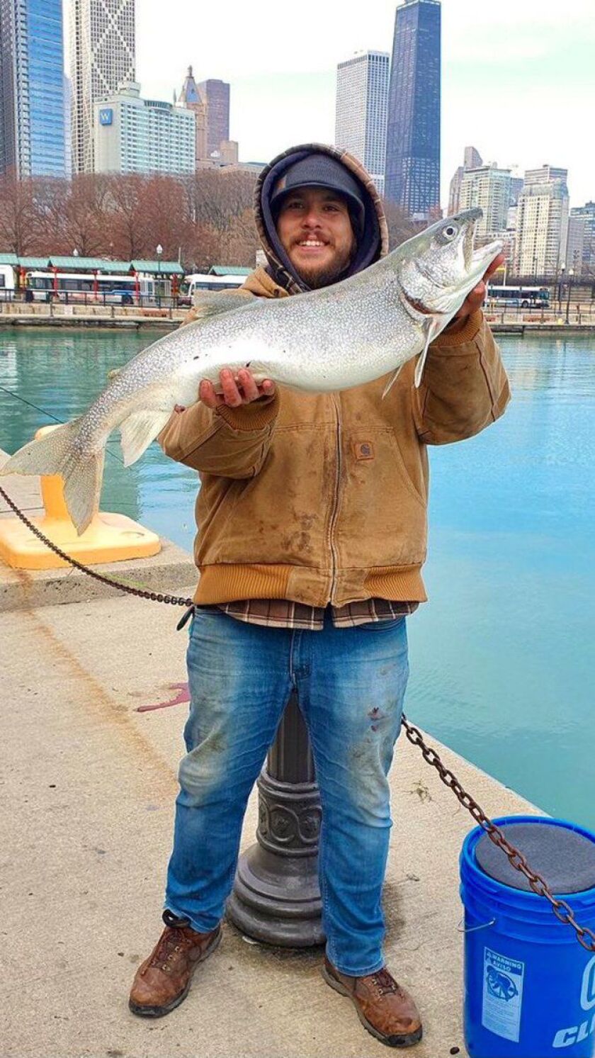 Quinn Wunar with his second and bigger lake trout at Navy Pier. Provided photo