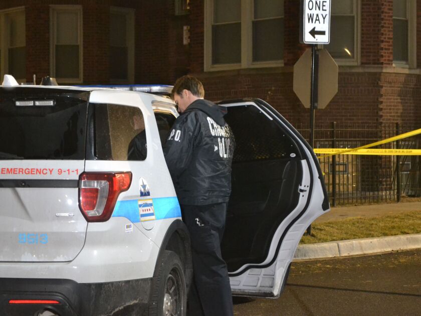 Police investigate the shooting of a 18-year-old man Friday evening in the 7400 block of South Colfax. | Justin Jackson/Sun-Times