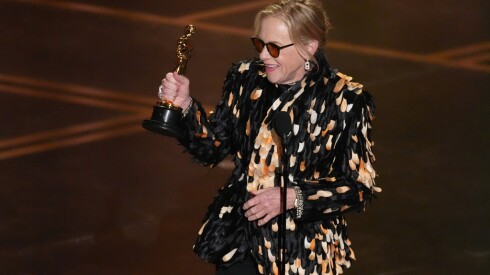 Amy Madigan accepts the award for actress in a supporting role for "Weapons" during the Oscars on Sunday, March 15, 2026, at the Dolby Theatre in Los Angeles. (AP Photo/Chris Pizzello)