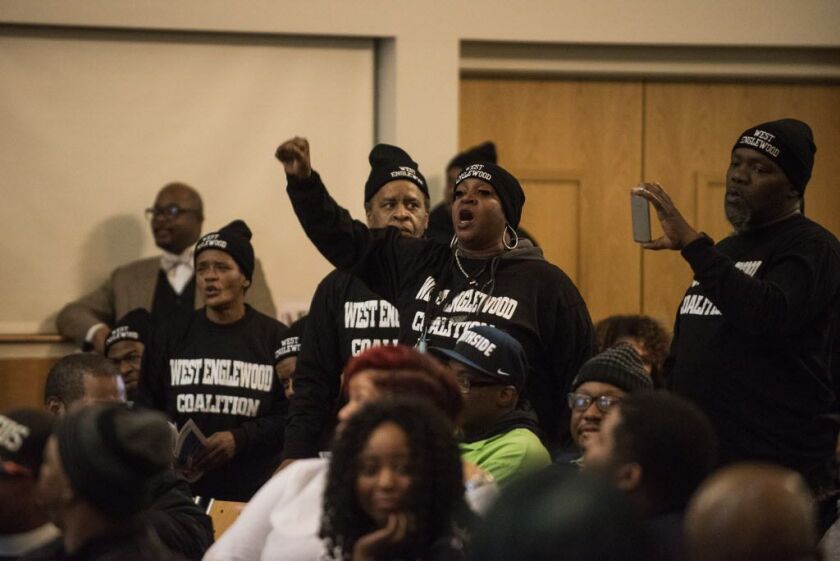 West Englewood Coalition members at a hearing Jan. 10 at Kennedy-King College, supporting plans to close Englewood’s four high schools and replace them with a new one on the campus of the current Robeson High School. | Max Herman/ Sun-Times