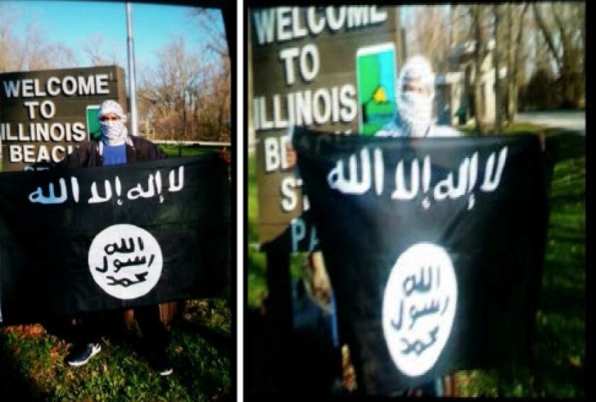 Joseph D. Jones, left, and Edward Schimenti holding ISIS falg at Illinois Beach State Park in Zion, according to a federal criminal complaint against the men. | Photo exhibit in federal complaint