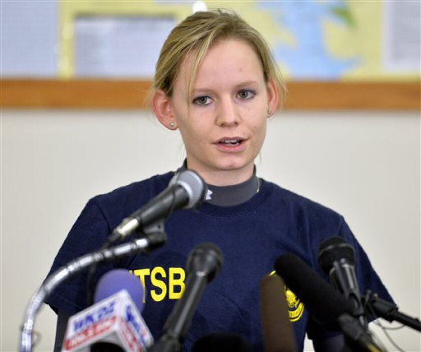 <small><strong>Heidi Moats, an air safety investigator with the National Transportation Safety Board, answers questions during a news conference Sunday in Eddyville, Kentucky. A 7-year-old girl was the only survivor when the plane crashed Friday night. |