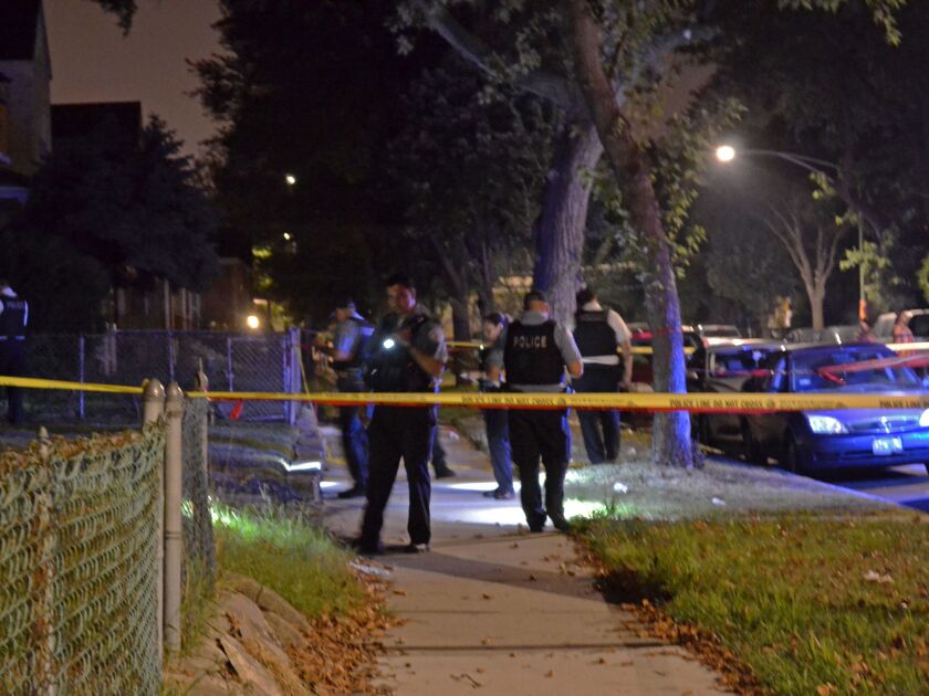 Police investigate a shooting about 1:30 a.m. Sunday, August 19, 2018 in the 6600 block of South Wabash Ave in Chicago. | Justin Jackson/ Sun-Times