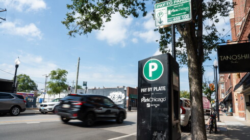 Traffic speeds by a ParkChicago payment machine on North Clark Street in Andersonville on Tuesday, Sept. 15, 2026.