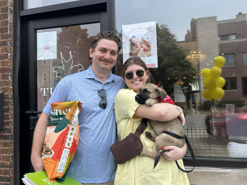 Trevor Davis and Katie Engle with their newly adopted puppy, Fritter.