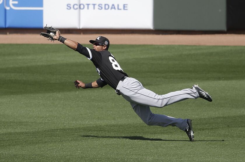 Jacob May makes a catch on a ball hit by Kansas City Royals’ Christian Colon. AP