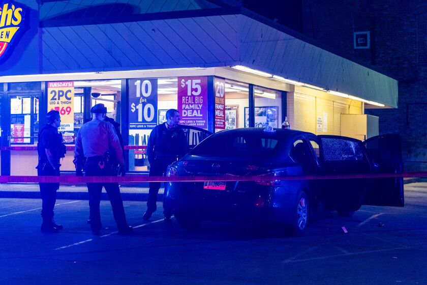 Illinois State Police and Chicago Police officers the scene where a woman was shot multiple times, Friday morning, in the first block of 59th Street. The shooting took place on I-94 Expressway near 76th Street. | Tyler LaRiviere/Sun-Times