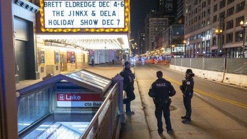 Chicago police investigate the scene where multiple people were shot outside the Chicago Theatre in the Loop, Nov. 21. The shooting occurred during a "teen takeover."