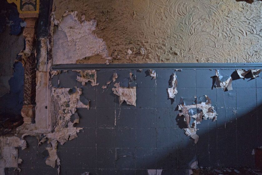 Some cosmetic work is needed, such as this peeling paint in the balcony, but owner Jerald Gary says the structure of the Avalon Regal Theatre is sound. | Max Herman/For the Sun-Times
