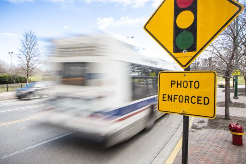 A sign at Sheridan Road and Belmont Avenue warns drivers they’re being watched by red-light cameras. | James Foster / Sun-Times