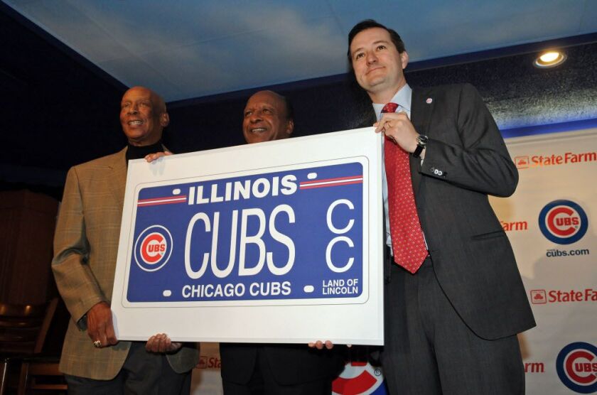 Ernie Banks, from left, Secretary of State Jesse White and Cubs chairman Tom Ricketts with a poster depicting a Cubs license plate in 2011. | Sun-Times files