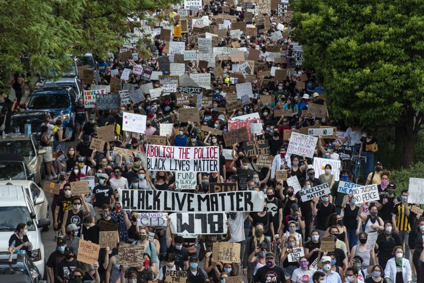 Thousands march though Chicago’s West Town neighborhood demanding that the city defund the Chicago Police Department, Friday afternoon, June 6, 2020.