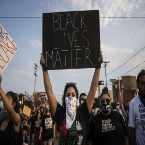 Protesters march around Kenosha in the second night of unrest after police shot Jacob Blake, Monday night, Aug. 24, 2020.