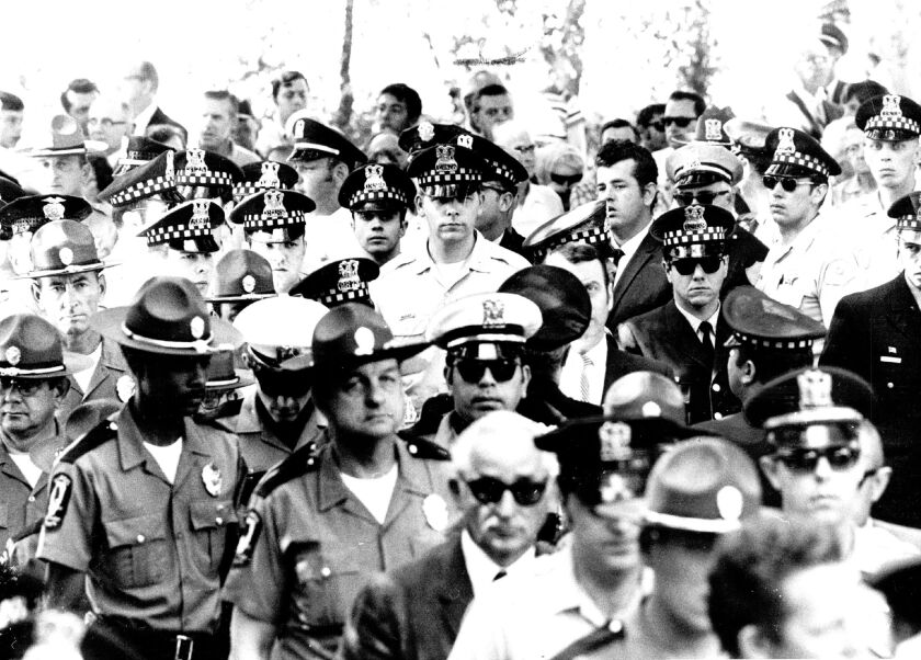 Family, friends, fellow officers and members of the public attend the funeral of Anthony Rizzato in 1970.