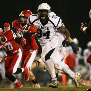Lisle’s Michael Walker (34) carries the ball for a big gain. | Allen Cunningham / for Chicago Sun Times