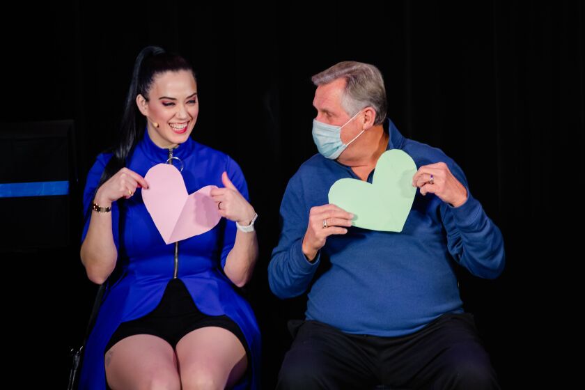 Kayla Drescher performs a magic trick with a random audience member during “Magic in Heels” at the Chicago Magic Lounge. | Sarah Elizabeth Larson, courtesy of Chicago Magic Lounge