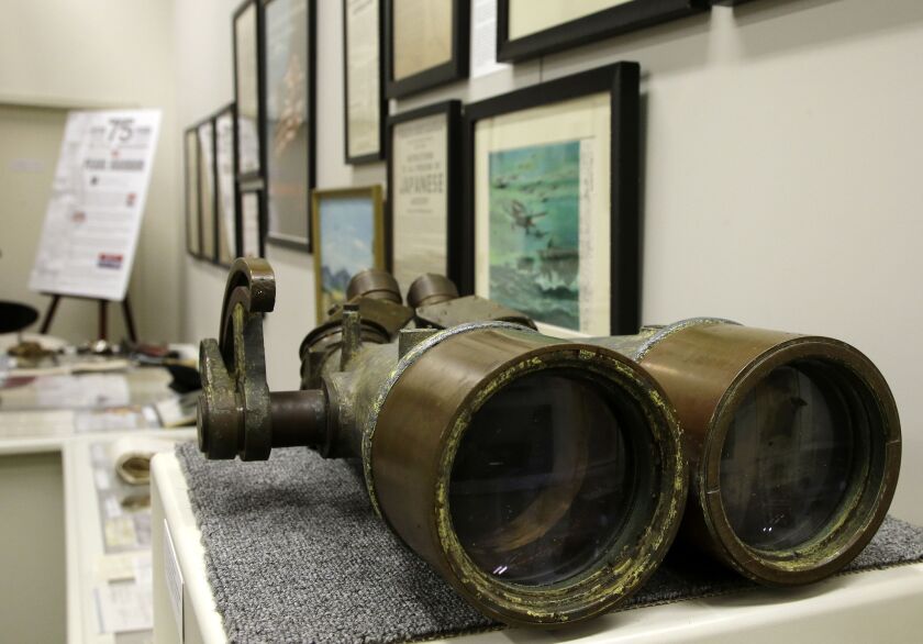 A pair of binoculars once belonging to the battleship USS Arizona are on display as part of an exhibit at The Museum of World War II, Boston, in Natick, Mass. The new exhibition, which opened Saturday, Oct. 8, features artifacts that have rarely been publ