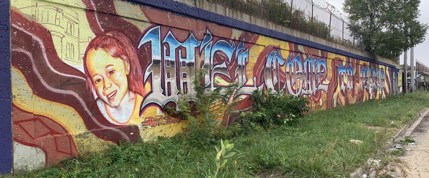 This mural, welcoming passersby to Pilsen, was done by the 43-year-old South Side artist who goes by Teasin. While painting, he said his ladder somehow broke and he broke three ribs. Also working on the project was his friend, the 42-year-old West Lawn artist who goes by Werm, who painted an image of his 6-year-old daughter on the wall. “She’s the future,” Werm says, “she’s drawing every day.”