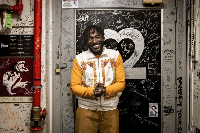 Hannibal Buress stands in the hallway outside his dressing room before performing stand-up comedy and music as Eshu Tune at The Chicago Theatre in the Loop, Thursday, Nov. 2.