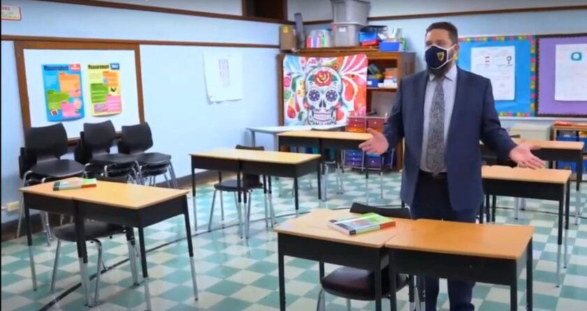 Erik Olson, principal at Hamline Elementary, walks through safety protocols at his school in a video presented at Chicago’s Board of Education meeting.