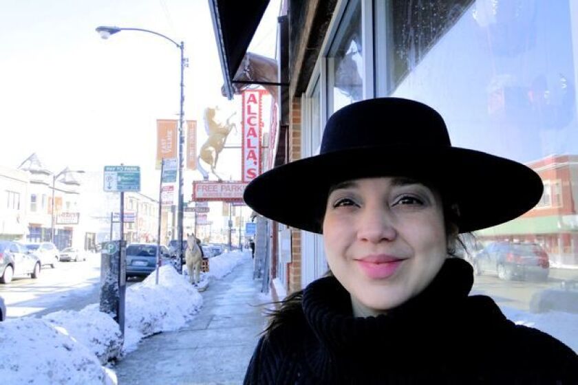 Elia Alcala outside Alcala’s, a third-generation family-owned store selling Western wear and boots. | Alisa Hauser/For the Sun-Times