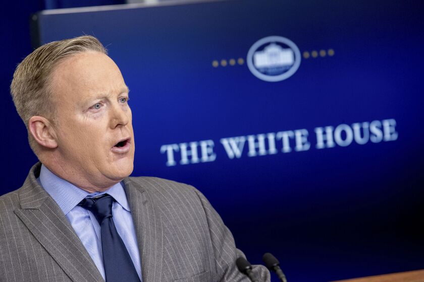 White House press secretary Sean Spicer speaks in the press briefing room at the White House on Saturday. Andrew Harnik/Associated Press