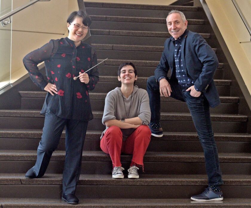 Conductor Mei-Ann Chen poses with “Sin Fronteras” composer Clarice Assad and Chicago Sinfonietta CEO Jim Hirsch in the lobby of Wentz Concert Hall on September 13, 2017, in Naperville, Illinois. (Jon Langham/for the Sun-Times)