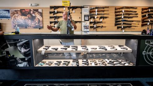 Robert Bevis, owner of Law Weapons and Supply in Naperville, holding an AR15 rifle. Bevis has asked the U.S. Supreme Court to overturn lower court rulings that upheld an assault weapons ban adopted by Naperville in 2022.