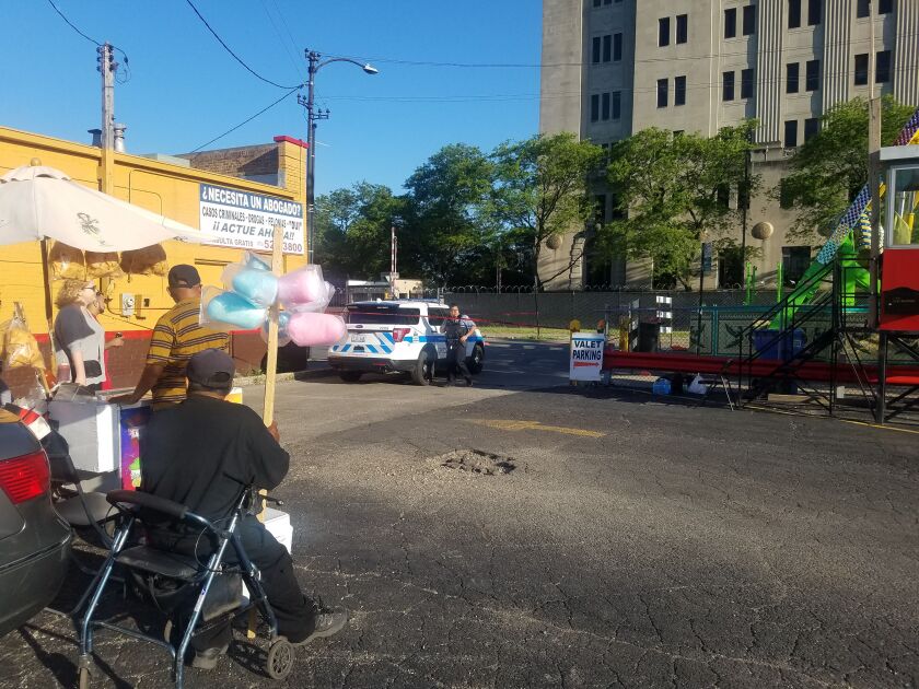 A man sells cotton candy near the scene of a shooting Sunday at a Little Village carnival. | Nader Issa/Sun-Times