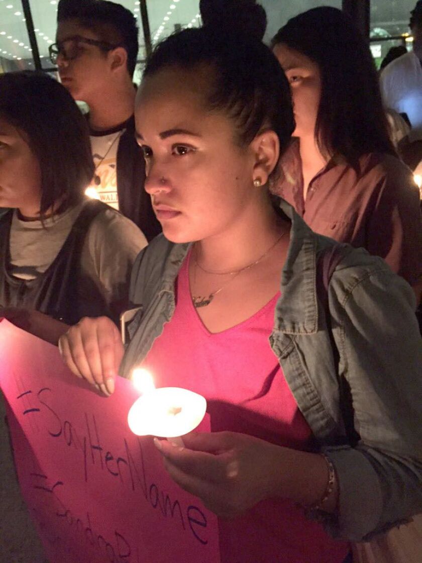 Noekai Avellan, of Chicago, at the vigil. | Paul Michna/Daily Herald via AP