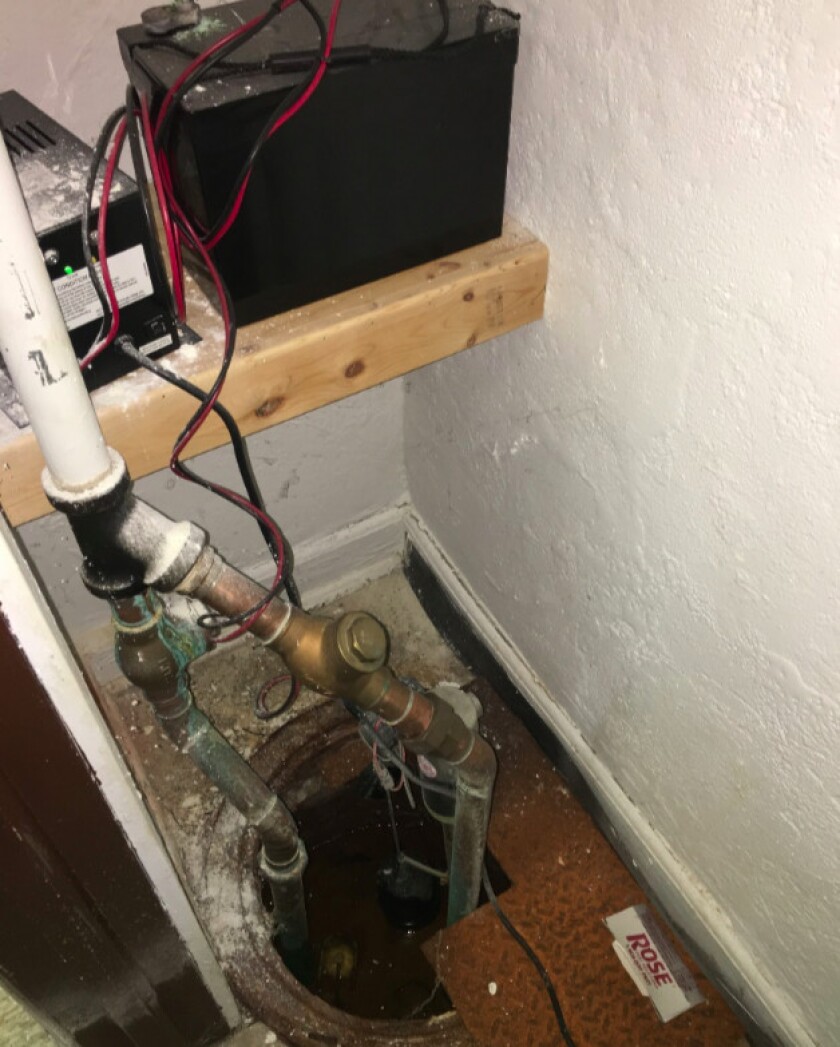 A sump-pump system is exposed at the Douglass Branch Library. | Photo provided by North Lawndale Community Coordinating Council