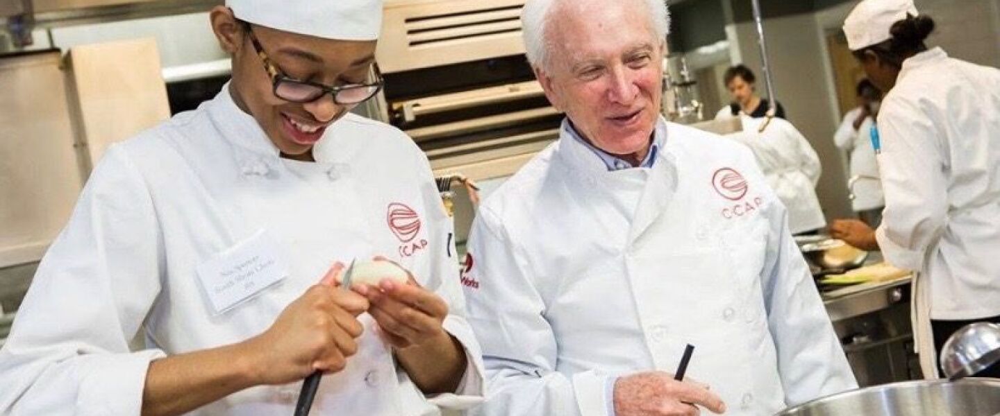 Nia Spencer, 21, prepares food alongside renowned culinary instructor Richard Grausman.