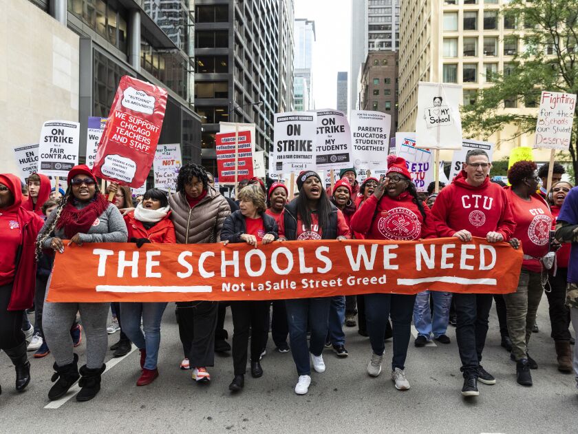 Chicago Teachers Union Vice President Stacy Davis Gates (center), other union officials and their supporters lead thousands of striking union members on a march through the Loop, Thursday afternoon, Oct. 17, 2019.