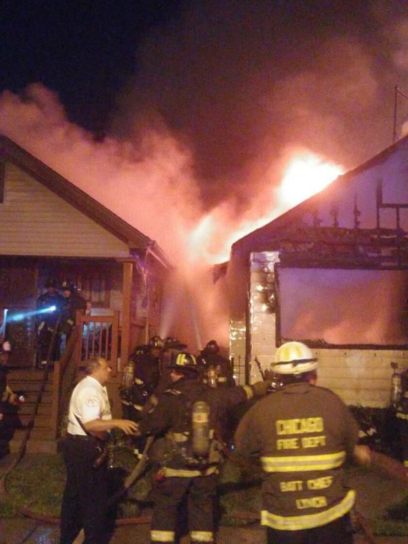 Fire crews at the scene of a fire in the 9900 block of South Wallace early Wednesday. | Fire Media Affairs