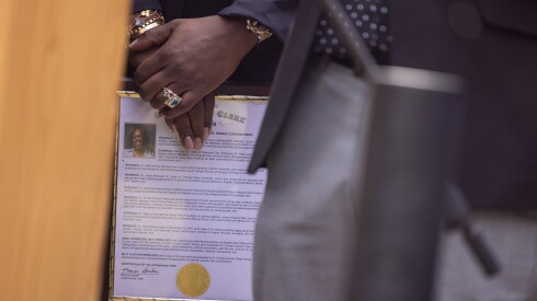 Musician Really Doe holds a posthumous resolution from the Cook County Clerk office honoring Dr. Donda West at her street naming ceremony in South Shore on the South Side, Tuesday, Sept. 22, 2026.