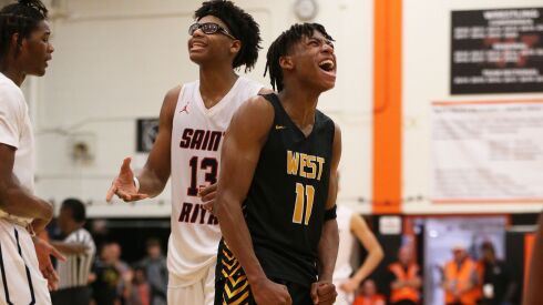Joliet West’s Jeremy Fears (11) begins to celebrate as the Tigers come from behind to defeat St. Rita
