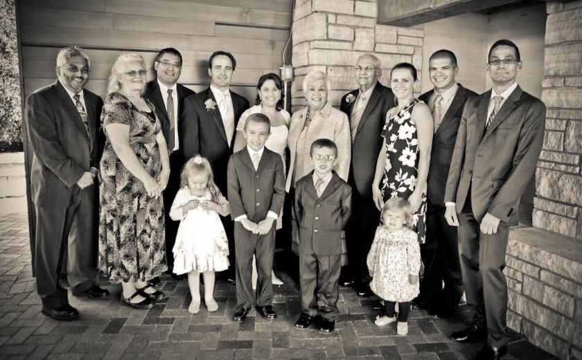 Manuel and Fally Sanchez (center) with their family.