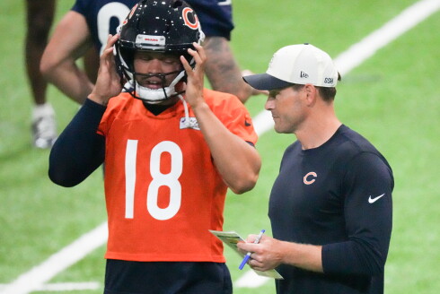 Bears head coach Ben Johnson talks with quarterback Caleb Williams during training camp at Halas Hall on Saturday, Aug. 1, 2026.