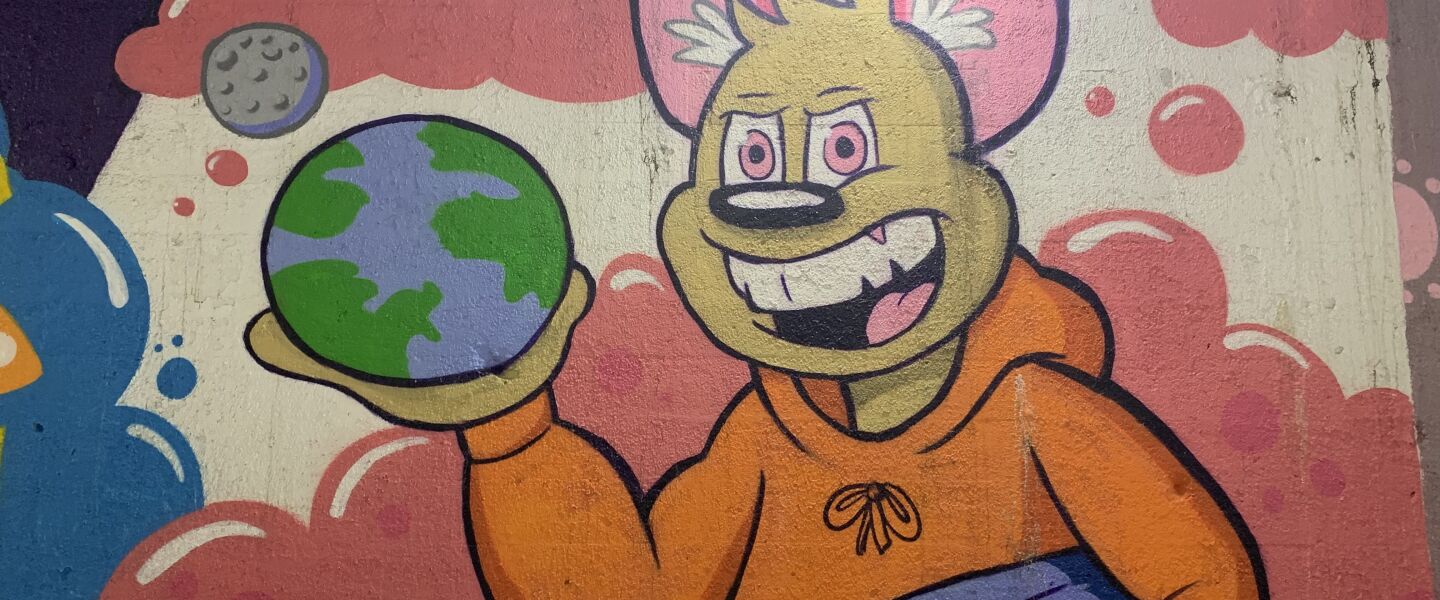 Palos Hills artist DOME says the images in this mural symbolized that “knowledge is power” and that his aim was to “speak to the children of the community, to push that message of study hard, and everything will kind of come together as long as you put the effort in.”