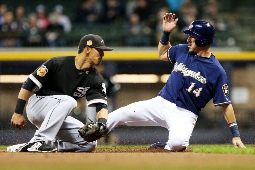 Hernan Perez of the Brewers steals second base as the White Sox’ Tyler Saladino applies a late tag at Miller Park Friday. (Getty Images)