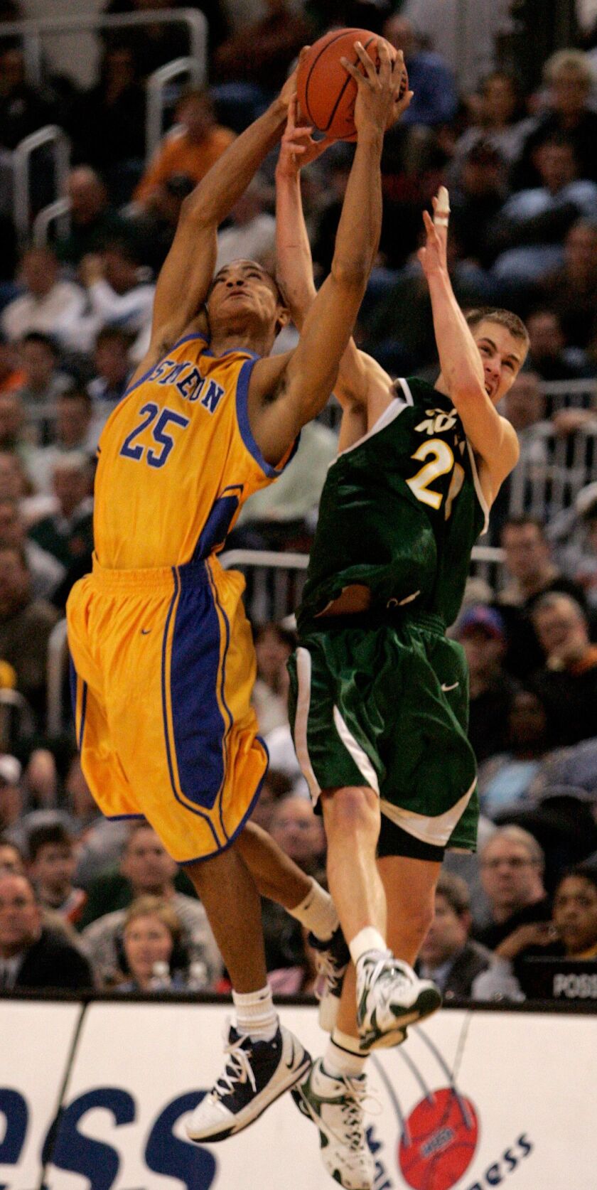 Glenbrook North’s Jonathan Scheyer, right, and Simeon’s Derrick Rose (25) go for the ball during the fourth quarter of the quarterfinals of the IHSA boys’ Class AA state basketball tournament in Peoria, Ill., Friday, March 17, 2006.