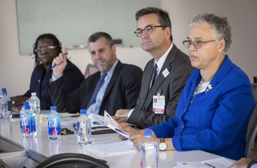 Then Cook County Health CEO John Jay Shannon, second from right, with County Board President Toni Preckwinkle, right, and other county officials in 2015.