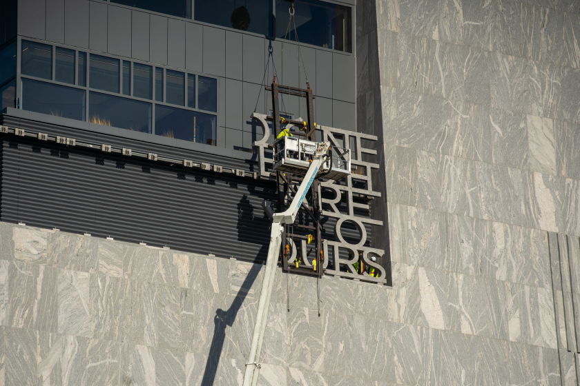 Five-foot-tall letters from a President Barack Obama speech are being installed atop the Obama Presidential Center Museum Tower.