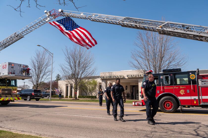 Chicago Fire Department personnel exit the wake for Lt. Jan Tchoryk at Cumberland Chapels funeral home in Norridge, Wednesday, April 12. Lt. Tchoryk, 55, a member of the department for 26 years, died April 5 while battling an extra-alarm blaze in a high-rise building on Lake Shore Drive in the Gold Coast neighborhood — the second firefighter to die in the line of duty that week.